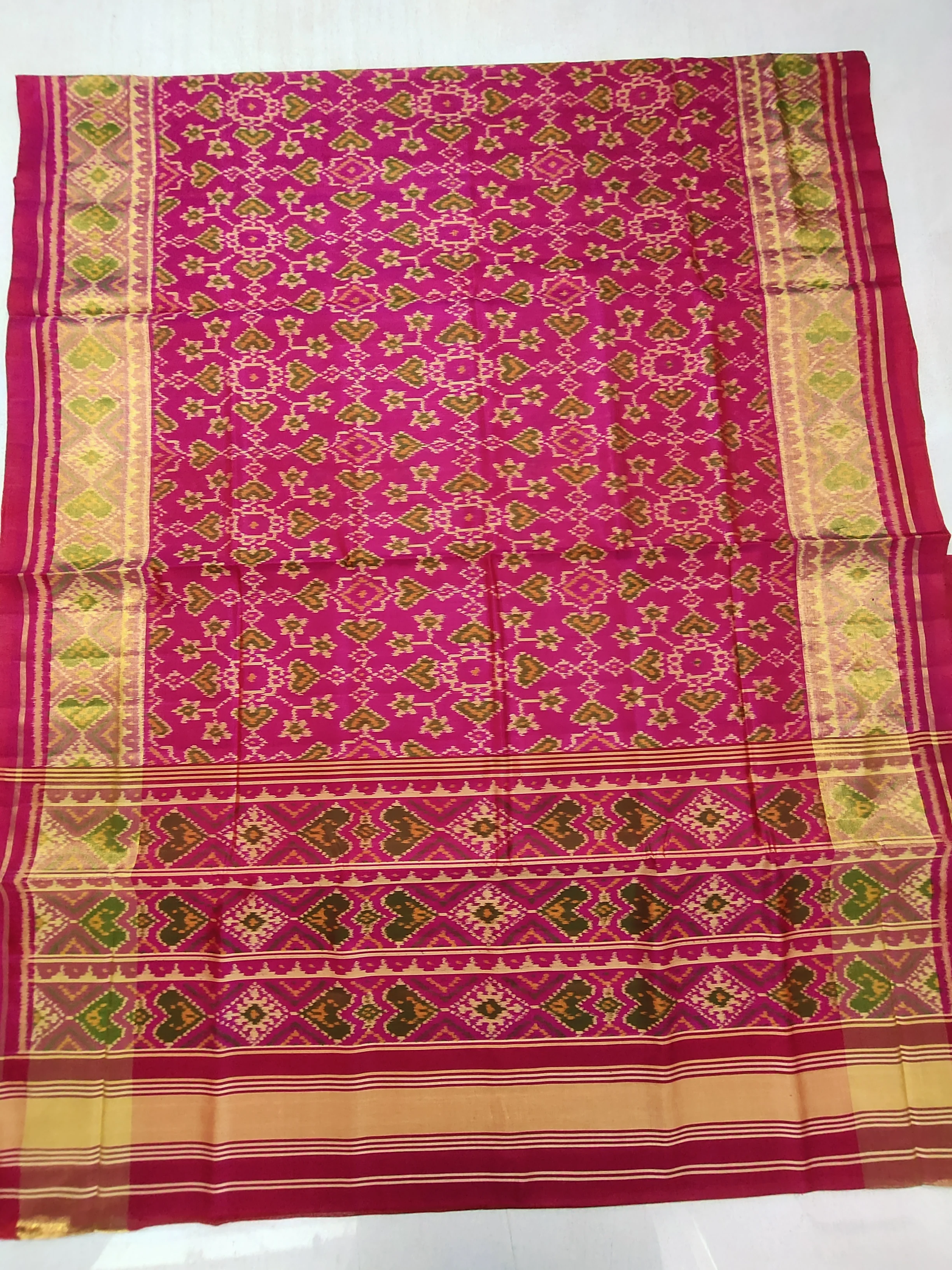 Pink Single Ikat Patola Saree with Selari Border and Navratan Manekchowk Motifs