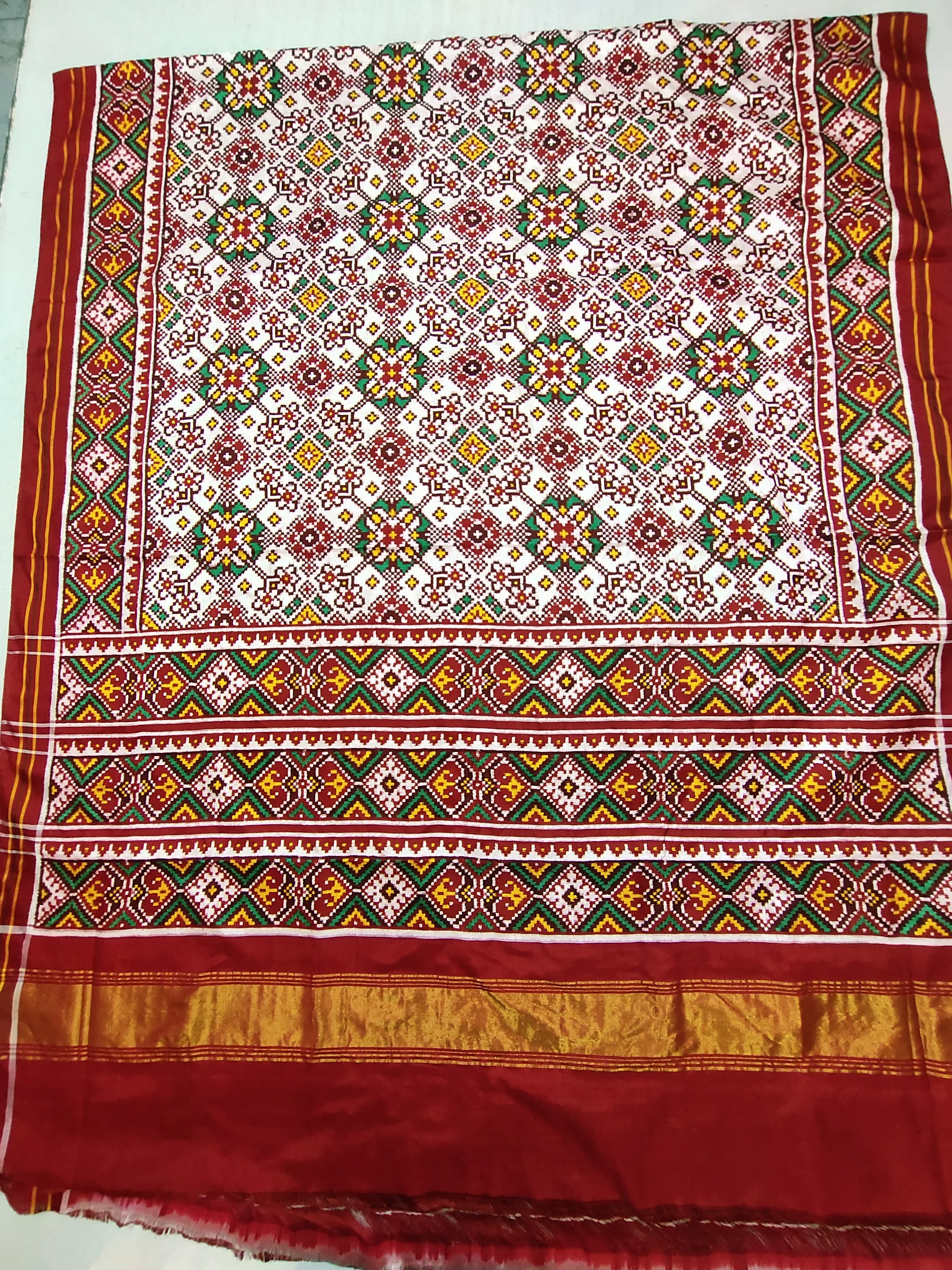 Double Ikat Patola Saree – Red & White | Navratan Motifs | Red Selari Border